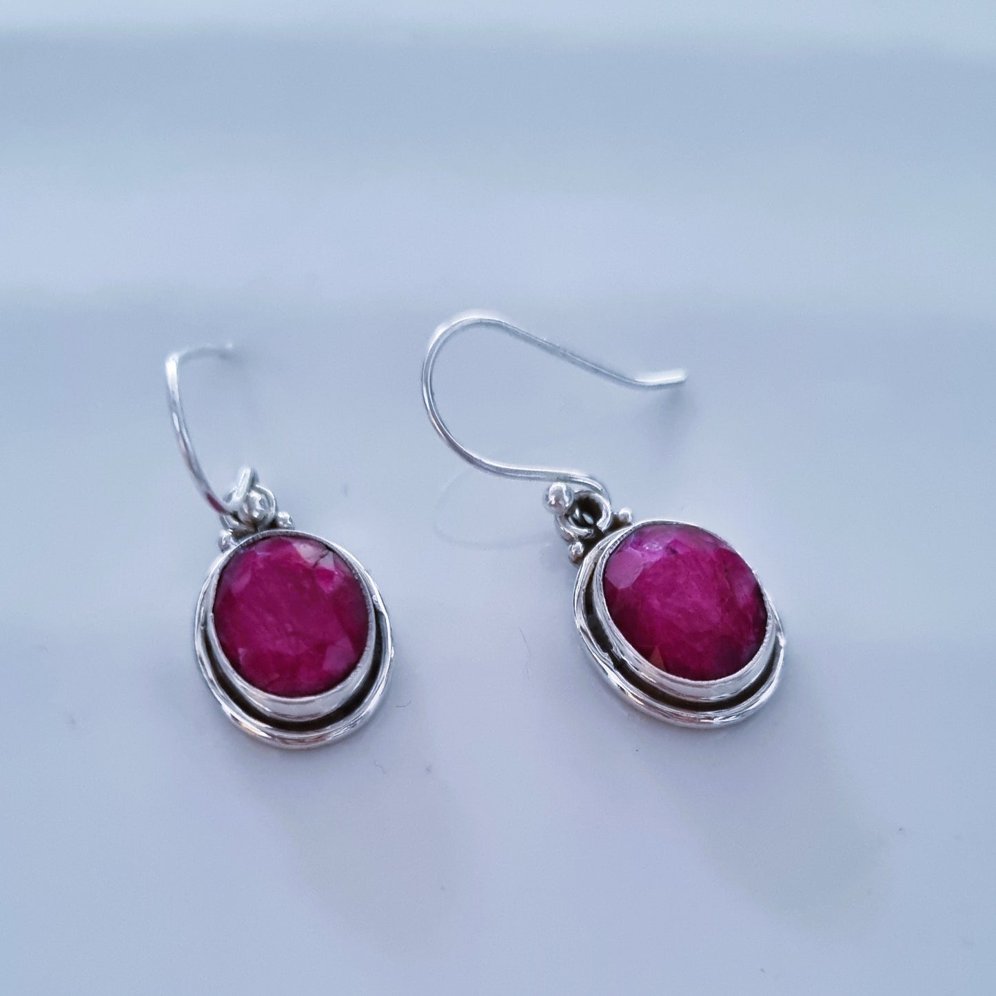 Oval ruby stones earrings