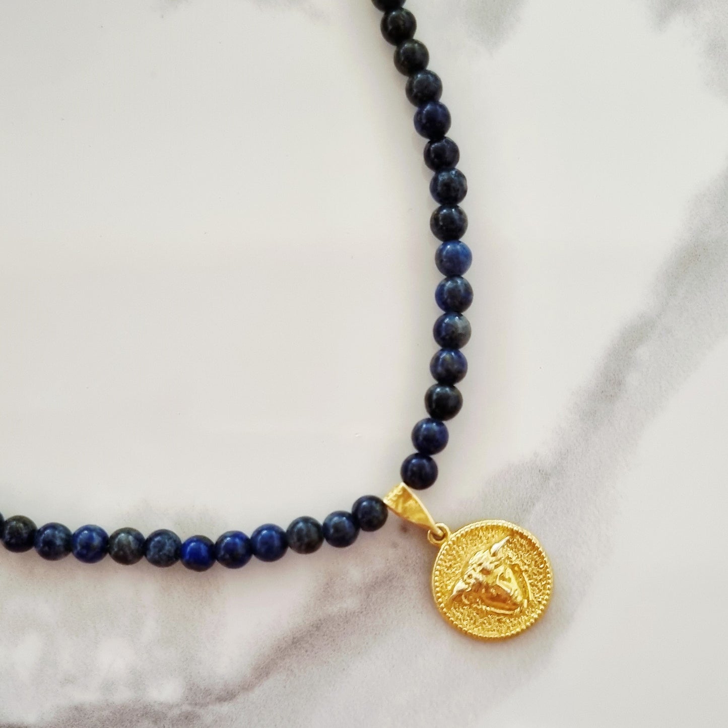 Gold medusa necklace