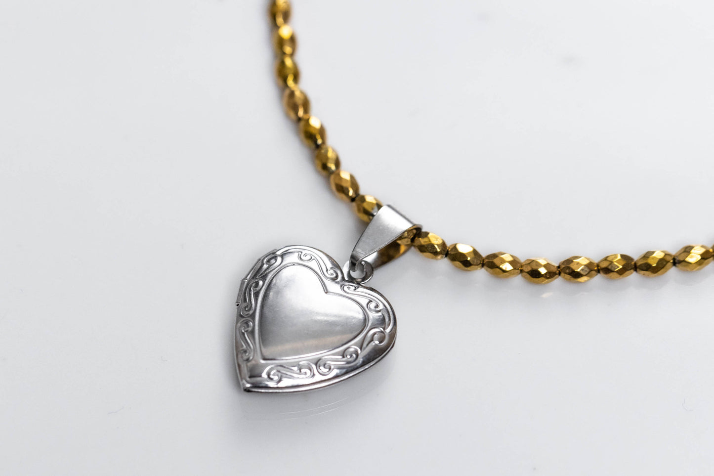 Gold hemate and heart locket