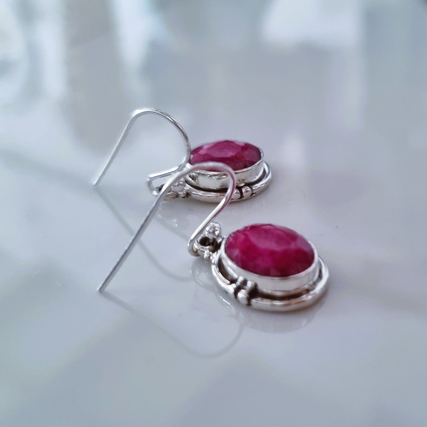 Oval ruby silver earrings