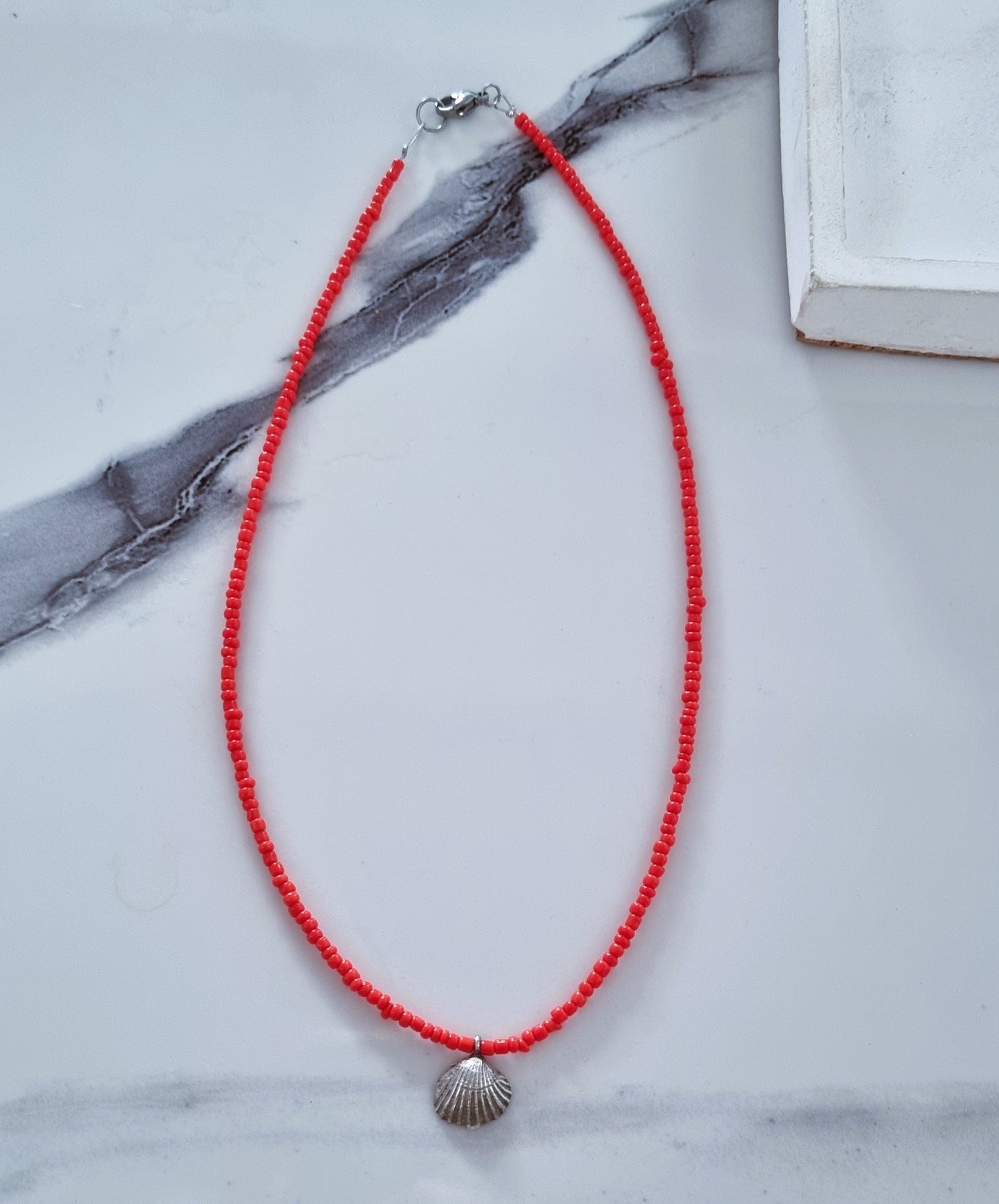 Coral and silver shell