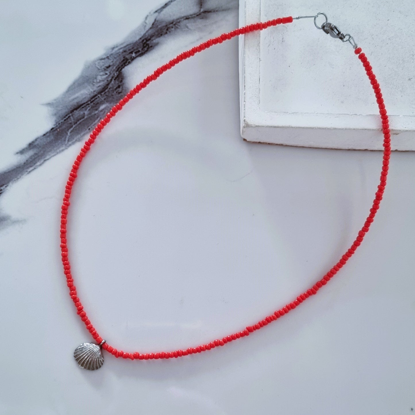 Coral and silver shell