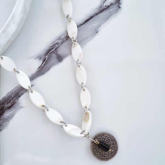 Mother of pearl but made it vintage