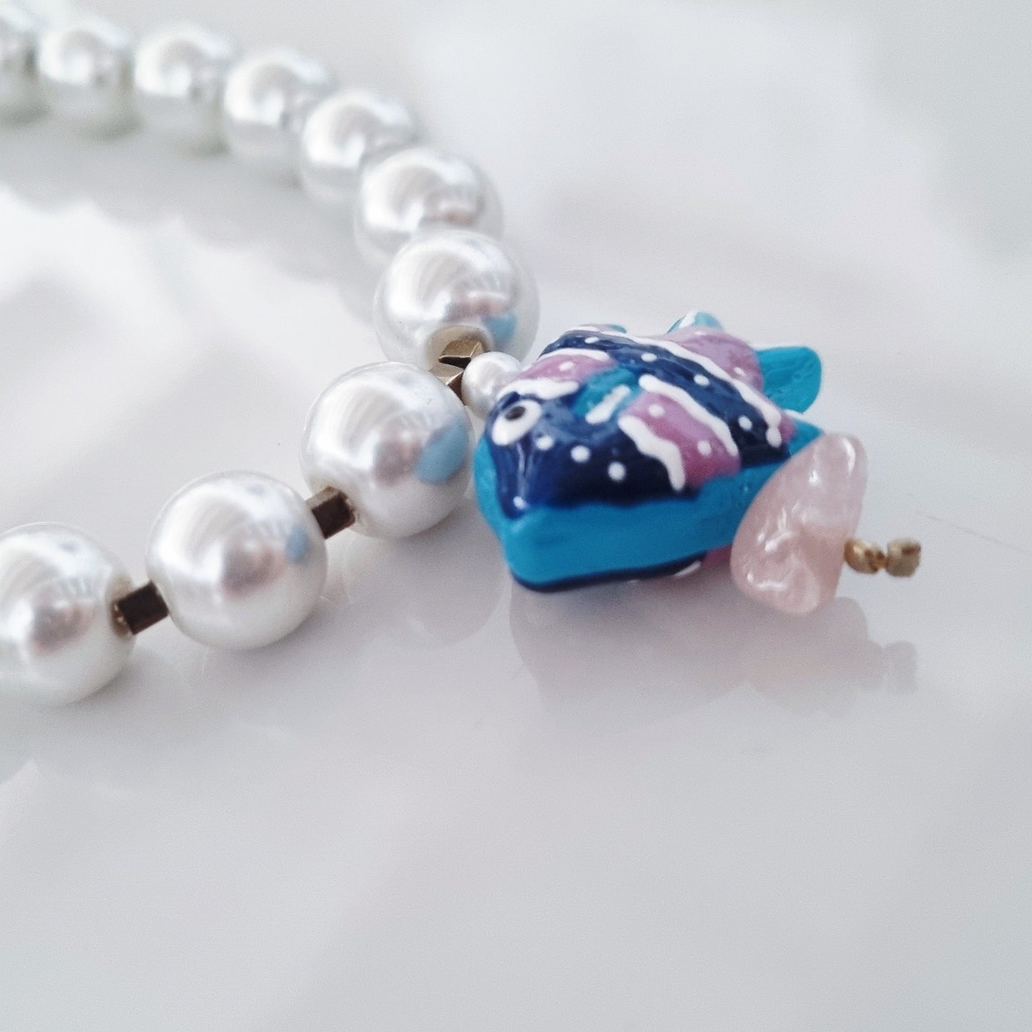 Pearls and blue fish