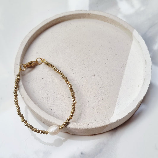 Gold and pearl bracelets