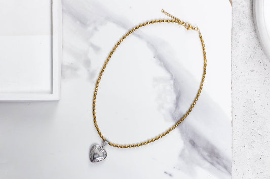 Gold hemate and heart locket